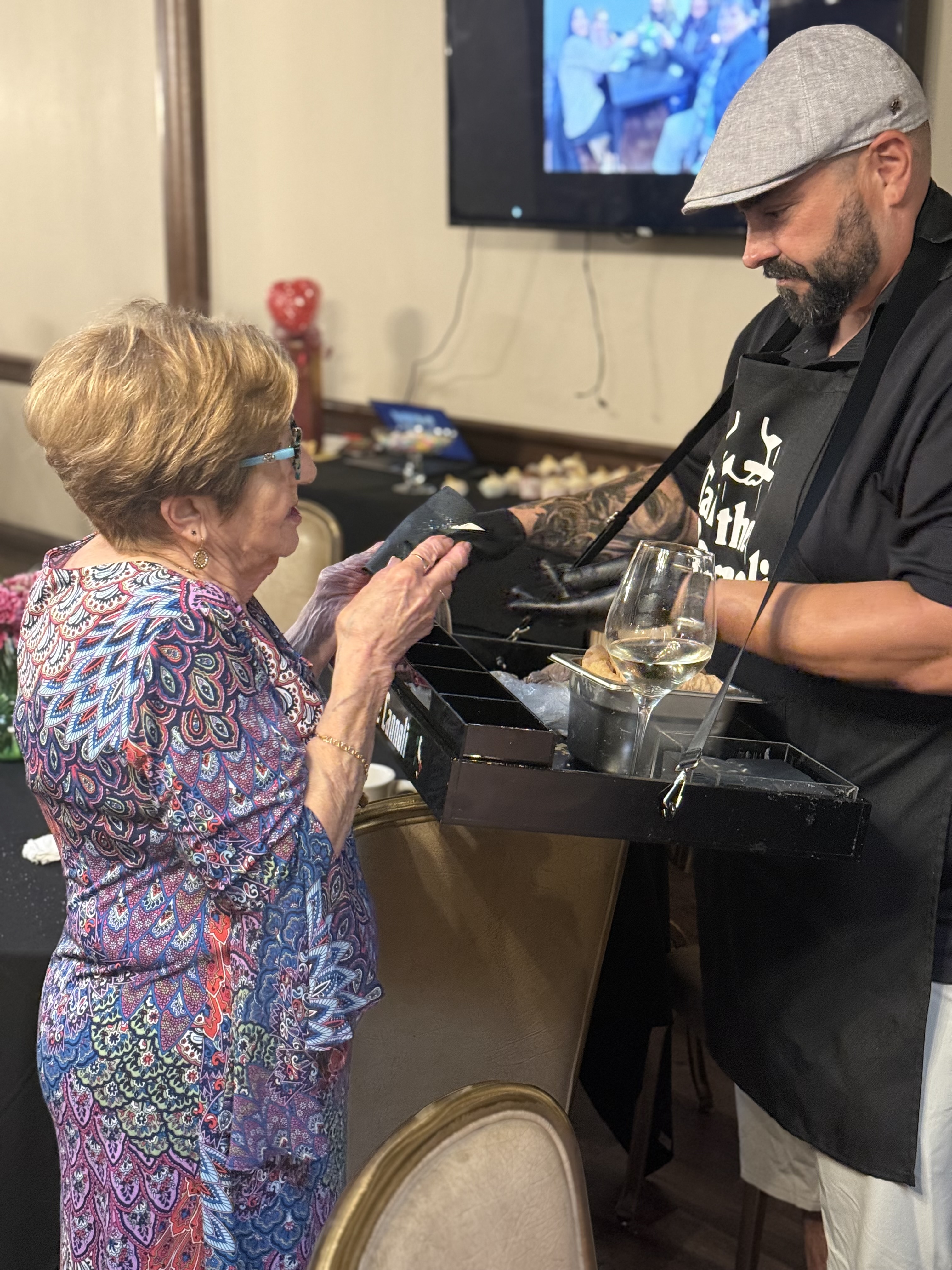 Frank serving a guest at a catering event